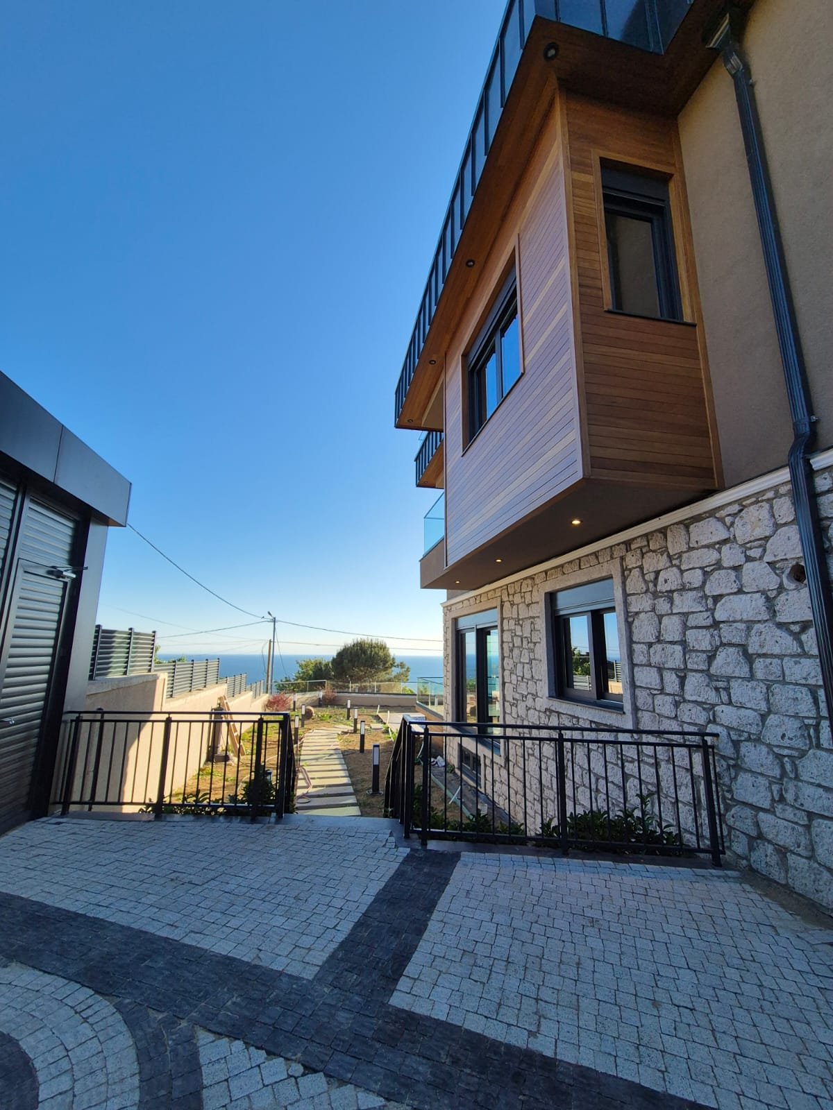 Marmara Haven Villa side entrance with a glimpse of the sea