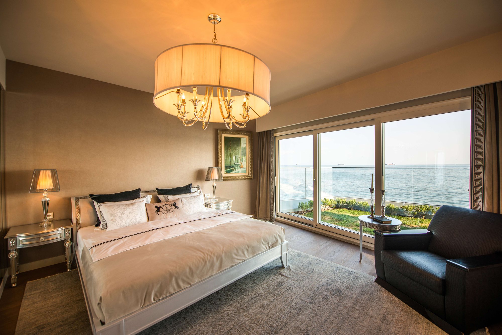 Sea Pearl Ataköy bedroom with the sea beyond the garden